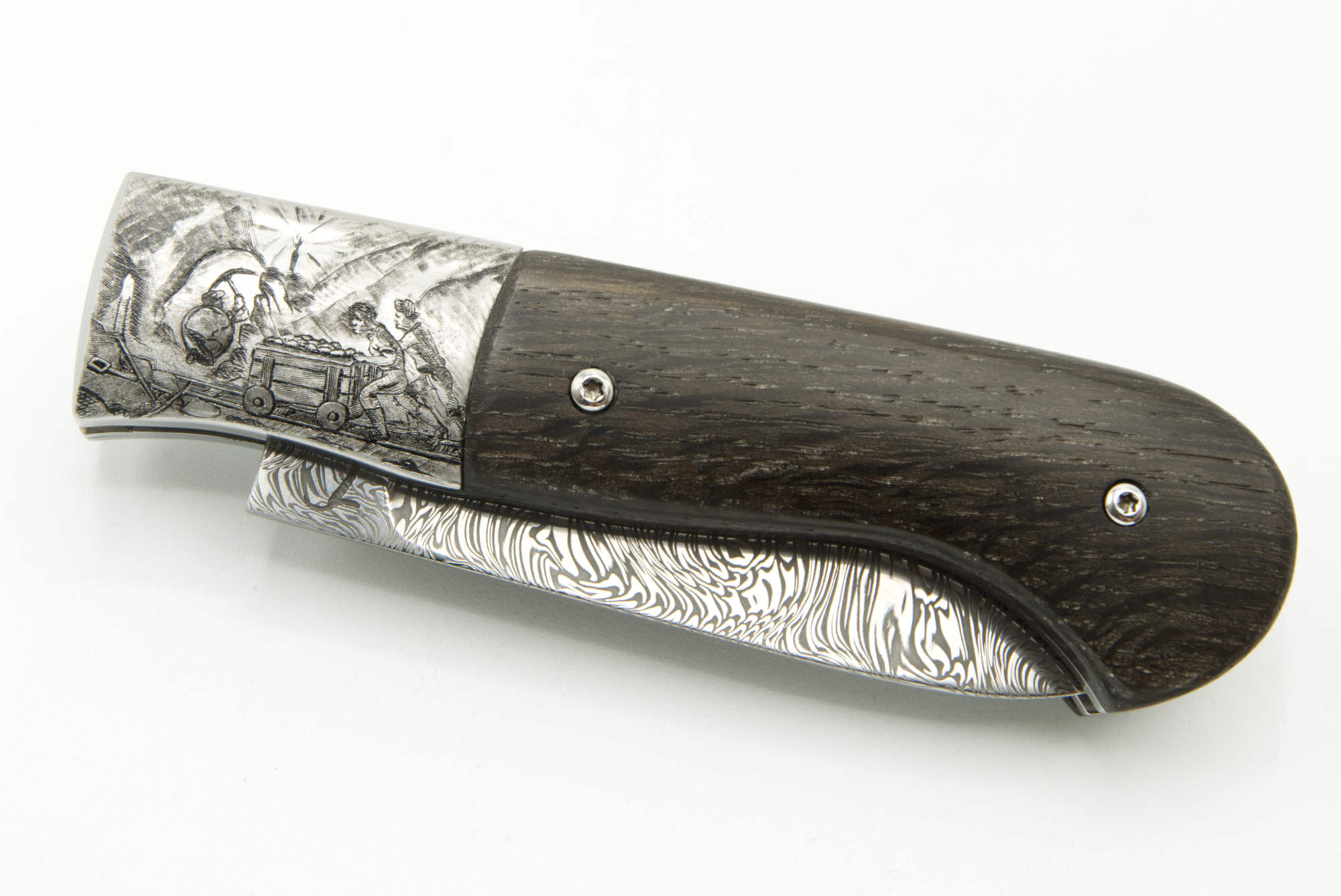 Gravure sur mesure : Mineurs au travail sur mitre de couteau en inox, technique taille douce